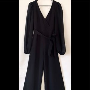 Black long sleeve jumpsuit with mesh sleeves